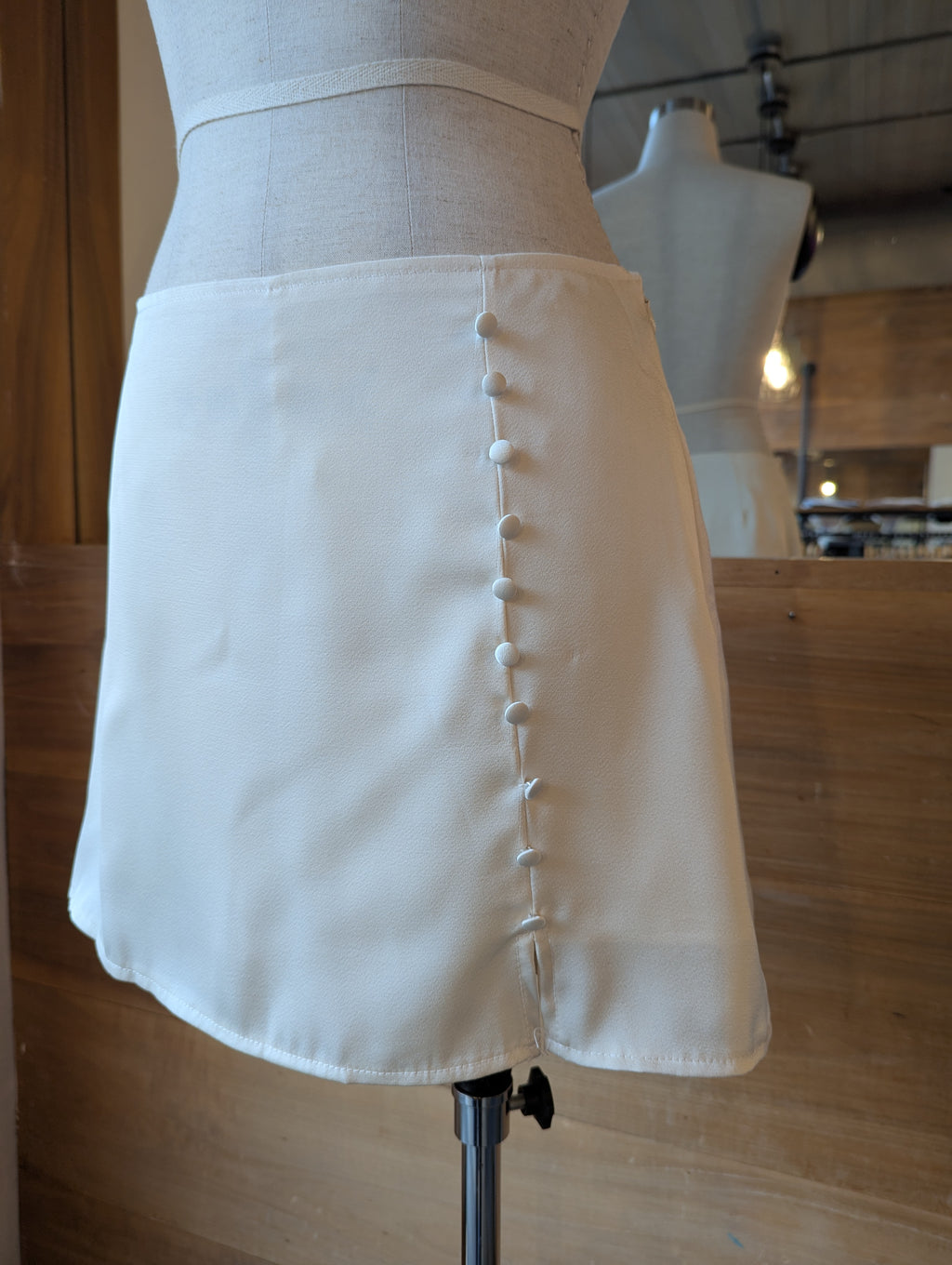 Pearl Faux Button Mini Skirt